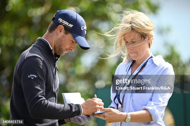 Tomas Detry of Belgium signs an autograph during a practice round prior to The 150th Open at St Andrews Old Course on July 13, 2022 in St Andrews,...