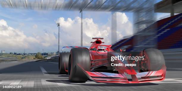 winning racing car moving at high speed across finish line of race track - close to finish line stock pictures, royalty-free photos & images