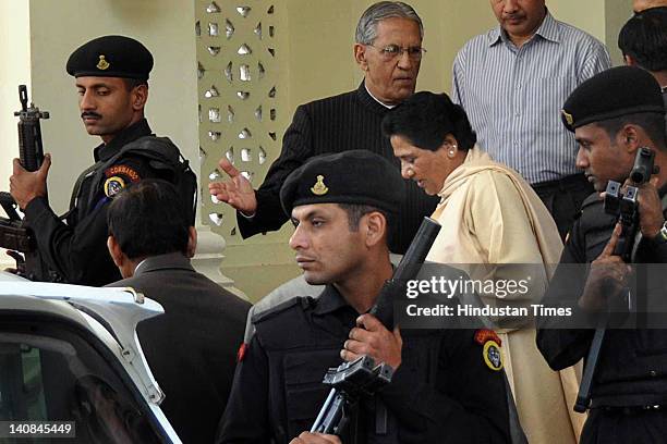 Uttar Pradesh Chief Minister Mayawati leaves after submitting her resignation to Governor Banwari Lal Joshi at his residence on March 7, 2012 in...