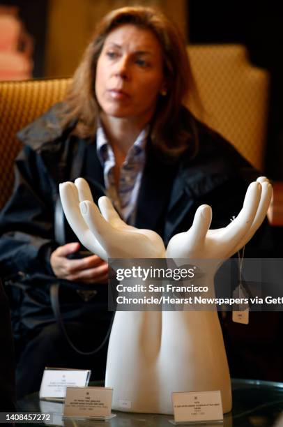 Joanne Lee watches the auction for antiques dealer Ed Hardy with both "sadness and curiosity" in San Francisco, Calif., on Tuesday, May 5, 2009. In...