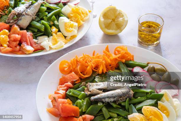 salat with canned sardines and a mix of vegetables - radish vinaigrette stock pictures, royalty-free photos & images