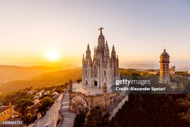 sagrat cor church on tibidabo mountain at sunset, aerial view, barcelona, spain - tibidabo fotografías e imágenes de stock