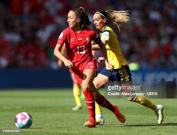 Lia Waelti of Switzerland is challenged by Kosovare Asllani of Sweden during the UEFA Women's Euro 2022 group C match between Sweden and Switzerland...