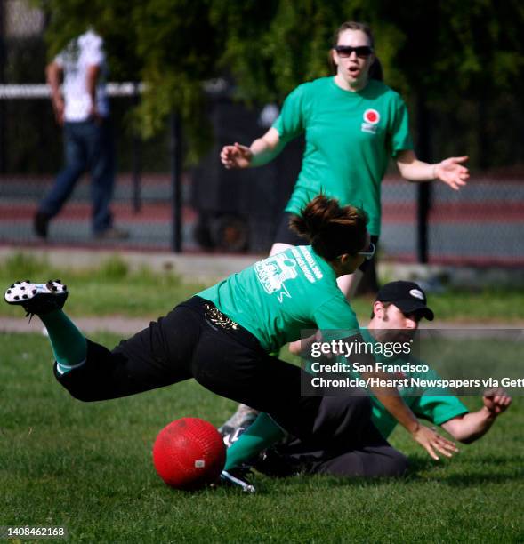 Players on the Spaceballs kickball team collide while fielding a kick by the High Rollers team during a game in a 16-team tournament of the World...