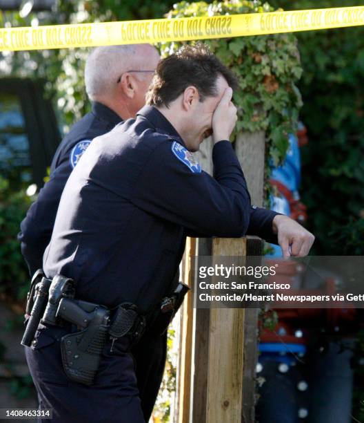Alameda police officials, including the Police Chief Walter Tibbet , monitor the investigation after an officer shot and killed a police dog named...