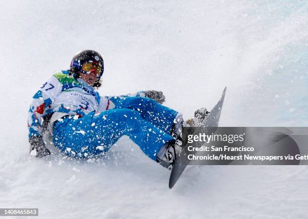 Claire Chapotot hits the snow hard when she lost control near the finish line in a qualifying heat of the women's snowboard cross competition in the...