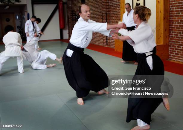 Ragnar Bohlin , chorus director for the San Francisco Symphony, practices akido with Sheilah Rogers at the Suginami Aikikai dojo in San Francisco,...