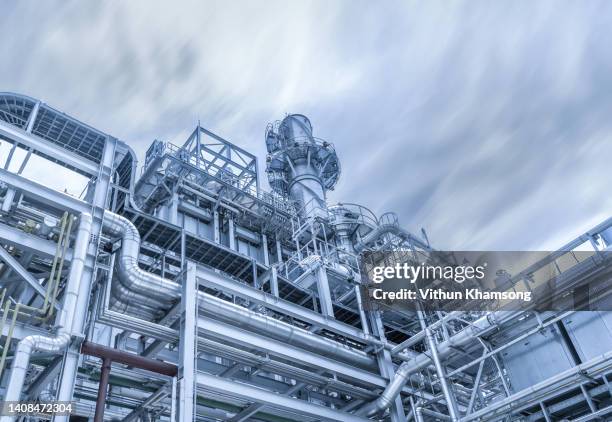 steel pipeline and sky at manufacturer industrial. - manufacture photos et images de collection