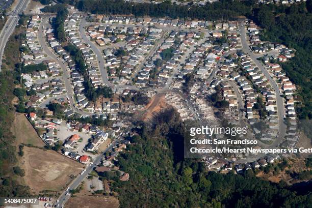 Large section of a neighborhood lies in ruins in San Bruno, Calif. On Friday, Sept. 10, 2010 after a massive natural gas pipeline explosion Thursday...