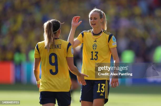 Amanda Ilestedt celebrates with Kosovare Asllani of Sweden after their sides victory during the UEFA Women's Euro 2022 group C match between Sweden...