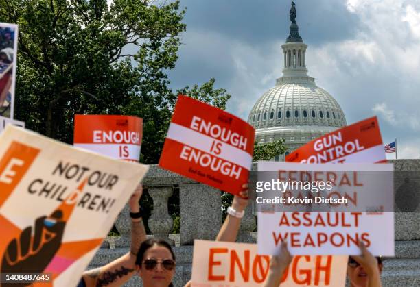 Gun control activists rally near the U.S. Capitol calling for a federal ban on assault weapons on July 13, 2022 in Washington, DC. Friends, family...