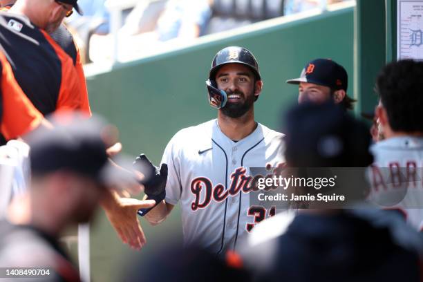 Riley Greene of the Detroit Tigers is congratulated by teammates in the dugout after scoring during the 1st inning of the game against the Kansas...