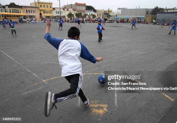 Lafayette Dolphins kickball player kicks the ball into play against the Jefferson Elementary School Jaquars in San Francisco, Calif. On Friday, May...