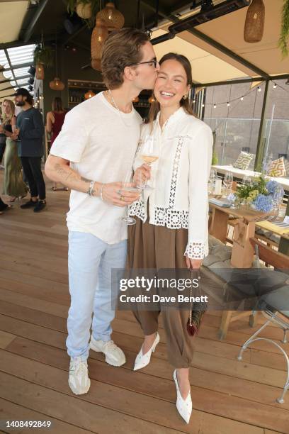 Oliver Proudlock and Emma Louise Connolly attend the Quatre Vin x Aerial Rooftop launch party at The Broadcaster on July 13, 2022 in London, England.