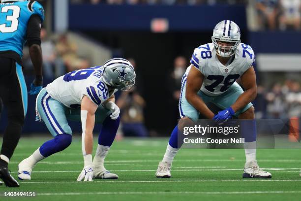 Blake Jarwin of the Dallas Cowboys and offensive tackle Terence Steele get set against the Carolina Panthers during an NFL game at AT&T Stadium on...