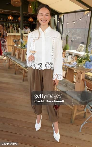 Emma Louise Connolly attends the Quatre Vin x Aerial Rooftop launch party at The Broadcaster on July 13, 2022 in London, England.