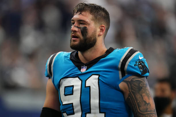 Morgan Fox of the Carolina Panthers walks off of the field against the Dallas Cowboys during an NFL game at AT&T Stadium on October 03, 2021 in...