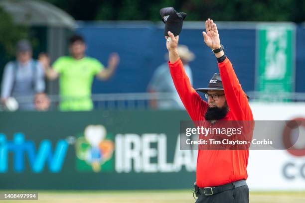 Dublin, Ireland July 12. Umpire Aleem Dar signals a six during the Ireland V New Zealand one day international at The Village, Malahide Cricket Club...