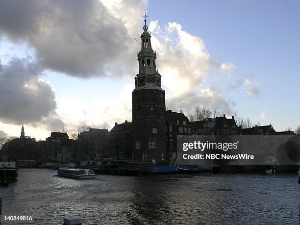 Amsterdam, Netherlands -- Pictured: The Oude Schans Canal, view of Montelbaens Tower, built in 1512 as part of the ancient defense wall of Amsterdam,...