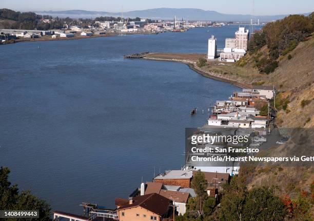 Waterfront homes are located just below the old General Mills flour mill in Vallejo, Calif. On Thursday, Dec. 31, 2015. Residents are fighting a...