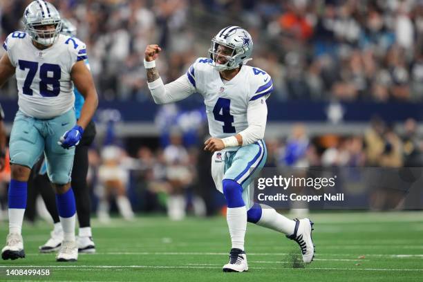 Dak Prescott of the Dallas Cowboys celebrates against the Carolina Panthers during an NFL game at AT&T Stadium on October 03, 2021 in Arlington,...