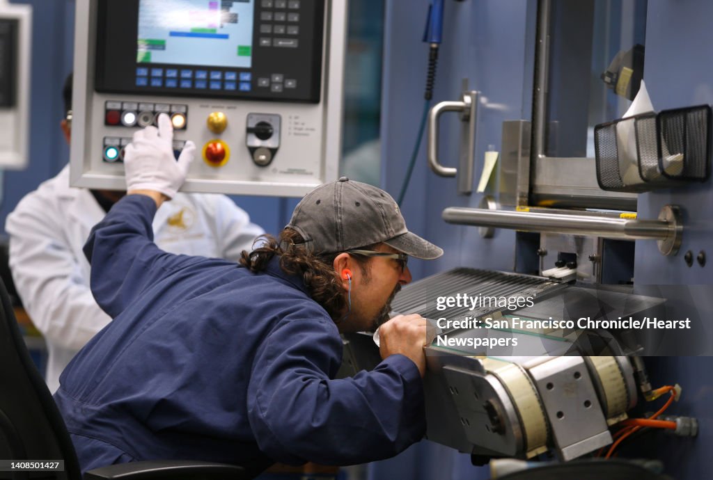 Pressman Gary Ruvo monitors the stamping of Sacajawea dollar coins at the United States Mint in San Francisco, Calif. on Wednesday, March 9. A limited release of 750,000 commemorative half-dollar coins to mark the 100th anniversary of the National Park Se