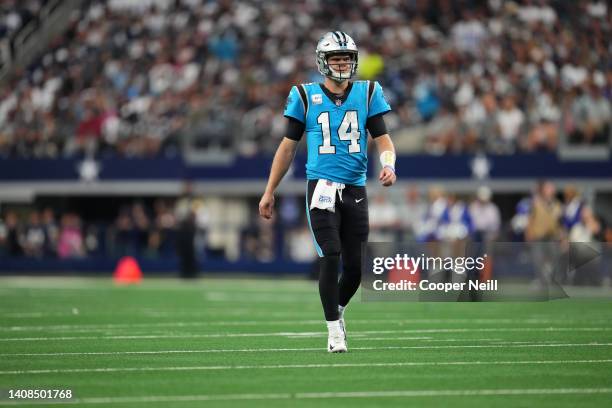 Sam Darnold of the Carolina Panthers walks down field against the Dallas Cowboys during an NFL game at AT&T Stadium on October 03, 2021 in Arlington,...