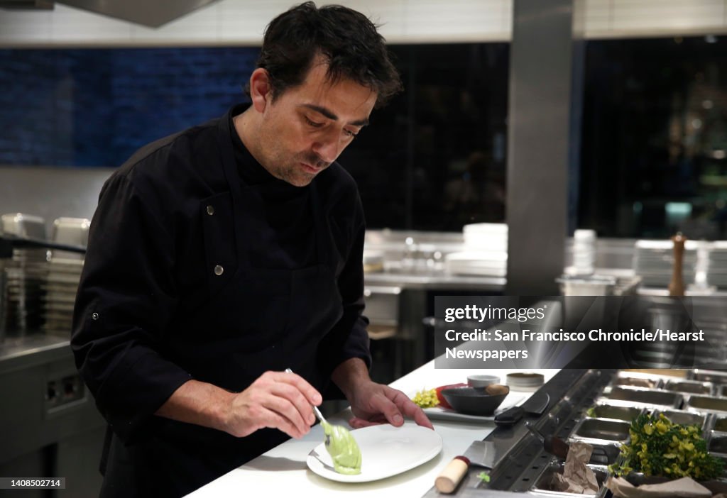 Matthew Dolan, co-owner and executive chef at Twenty Five Lusk, prepares escargot caviar and ahi tuna crudo with mustard blossoms, black salt and a green garlic mousse in San Francisco, Calif. on Saturday, March 19, 2016