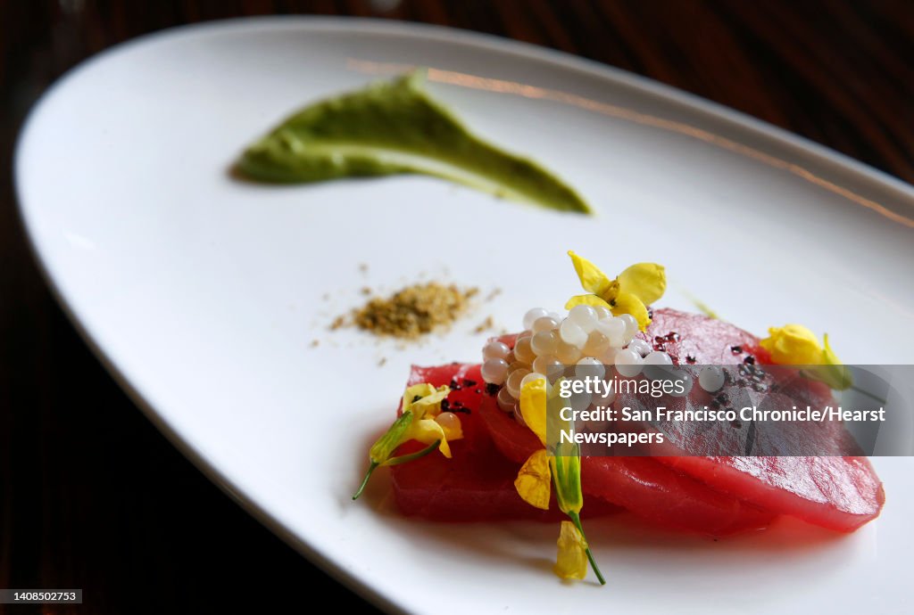Matthew Dolan, co-owner and executive chef at Twenty Five Lusk, prepares escargot caviar and ahi tuna crudo with mustard blossoms, black salt and a green garlic mousse in San Francisco, Calif. on Saturday, March 19, 2016