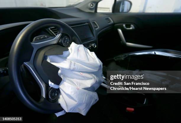 The deflated airbag of Brittany Benson's 2015 Honda Civic is seen at her home in San Francisco, Calif. On Tuesday, Aug. 23, 2016. Benson left her...