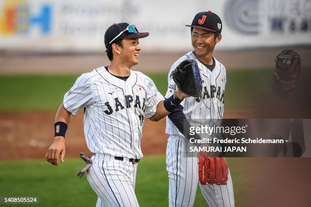 Kosei Shoji and Ryuhei Sotani of Japantalk to each other during the Netherlands v Japan game during the Honkbal Week Haarlem at the Pim Mulier...