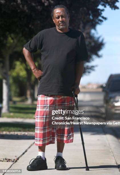 Kevin Hart uses a cane to walk down the street at his home in Elk Grove, Calif. On Friday, Sept. 23, 2016. Hart was the lead plaintiff in a newly...