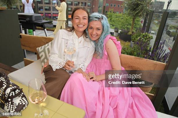 Emma Louise Connolly and Portia Freeman attend the Quatre Vin x Aerial Rooftop launch party at The Broadcaster on July 13, 2022 in London, England.