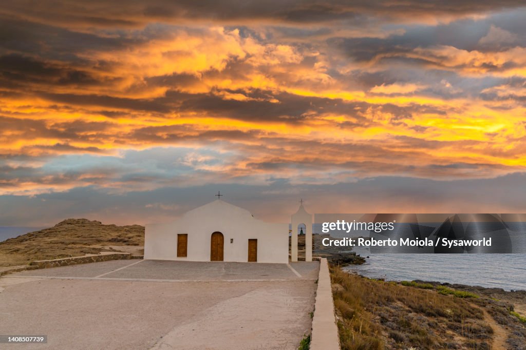 Dramatic sunset over the traditional Greek church