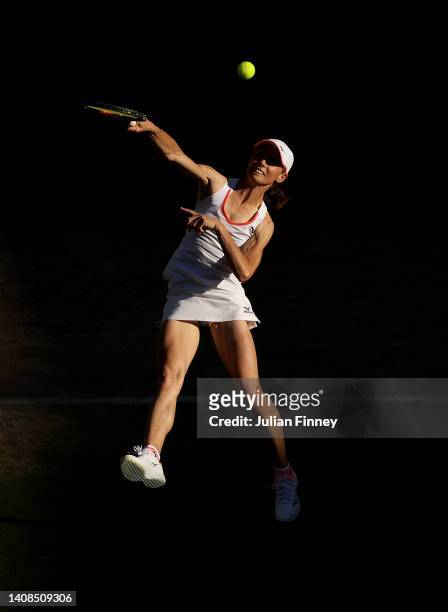Cara Black of Zimbabwe plays a smash with Todd Woodbridge of Australia against Mansour Bahrami of Iran and Conchita Martinez of Spain during their...
