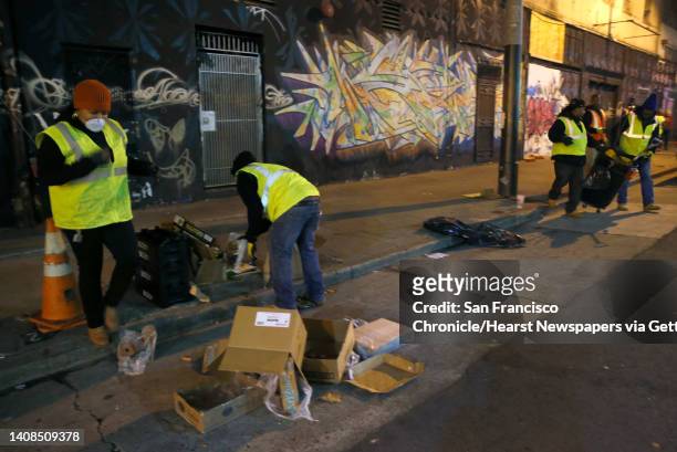 Sammisha Hicks and other members of the TL Cares clean team fan out across the Tenderloin to pick up trash for the Department of Public Works in San...