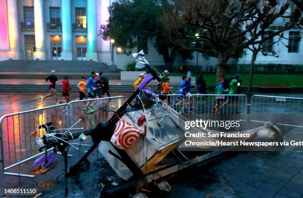 Group of runners jog past a portable light on Sproul Plaza at UC Berkeley on Thursday, Feb. 2, 2017 that was burned by vandals after Wednesday...