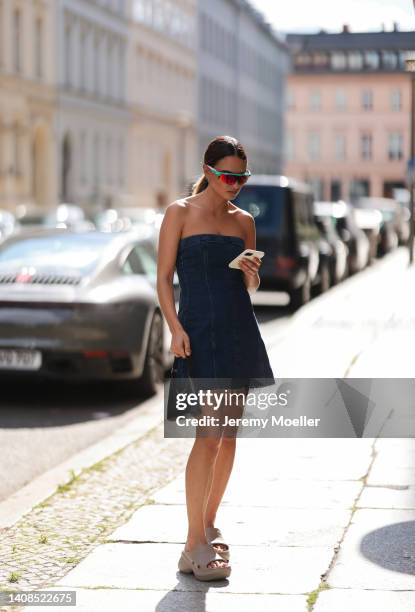 Anna Winter is seen wearing Balenciaga Rubber Pool slide sandals in beige, Oakley shades, ByFar black mini leather bag & weworewhat dark denim mini...