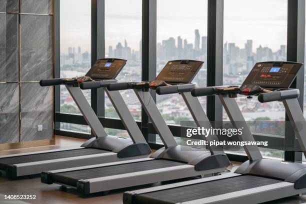 treadmill located inside a gym on a high-rise condominium building. - dedication background stock pictures, royalty-free photos & images