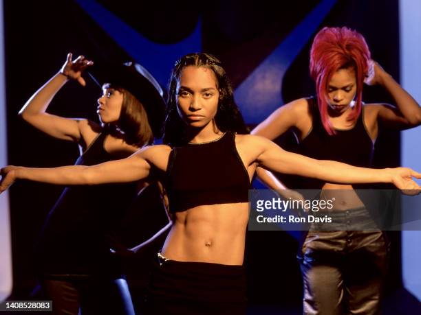 American singers, Lisa Left Eye Lopes , Rozonda Chilli Thomas and Tionne T-Boz Watkins, of the American girl group TLC, pose for a studio portrait in...