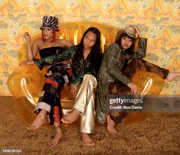 American singers, Tionne T-Boz Watkins, Rozonda Chilli Thomas and Lisa Left Eye Lopes , of the American girl group TLC, pose for a studio portrait in...