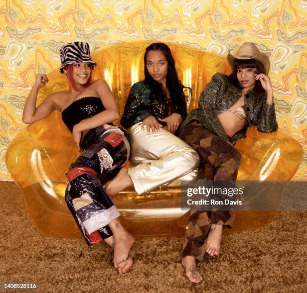 American singers, Tionne T-Boz Watkins, Rozonda Chilli Thomas and Lisa Left Eye Lopes , of the American girl group TLC, pose for a studio portrait in...