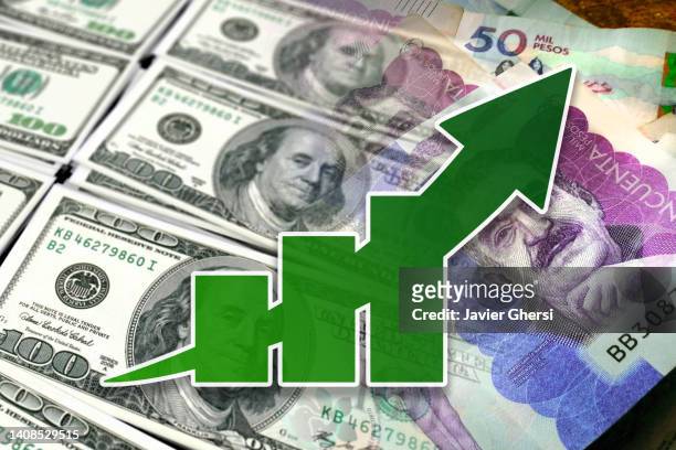 economy graph: rising arrow, and cash bills of dollars and colombian pesos - colombian peso stock pictures, royalty-free photos & images