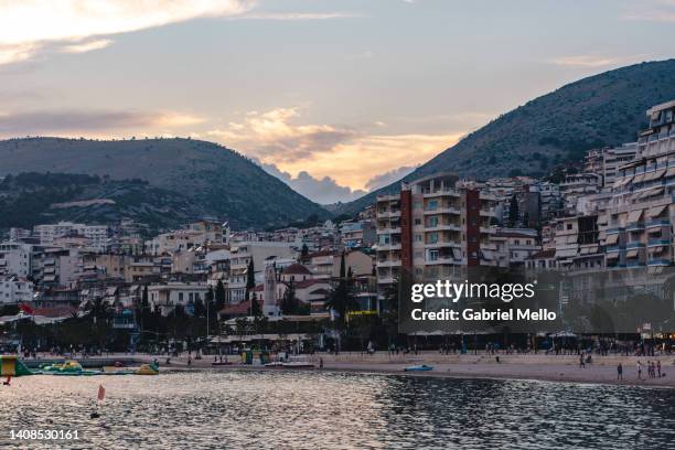 sea view and sarande town during sunset - sarande albania stock pictures, royalty-free photos & images