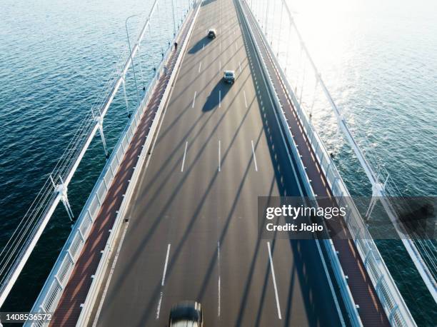 modern bridge and sea - car finish line stock pictures, royalty-free photos & images