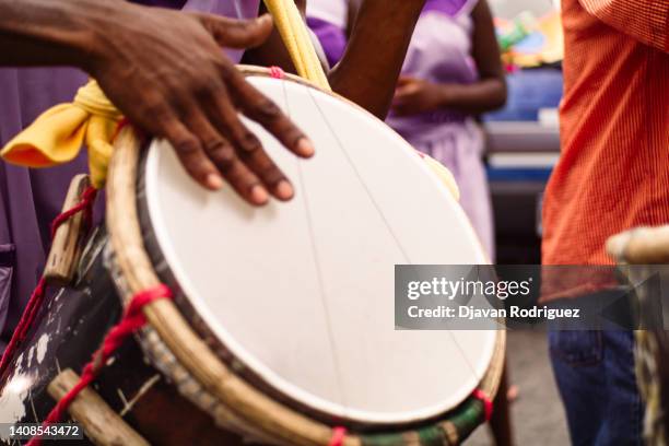 close up of hands of a person playing ethnic drums concept party and carnival cultural events. - tradición fotografías e imágenes de stock