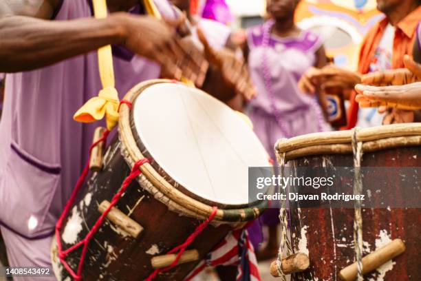 hands of a person playing ethnic drums concept party and carnival cultural events. - samba fotografías e imágenes de stock