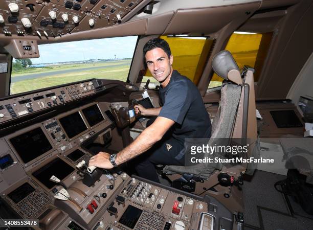 Arsenal manager Mikel Arteta in the cockpit of the Arsenal team plane to the USA on July 13, 2022 in Stansted, Essex.