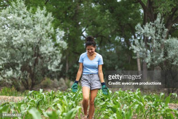 surveying garden plants teenage rural life in western usa kazan asian teen female living on a farm photo series - may 16 stock pictures, royalty-free photos & images