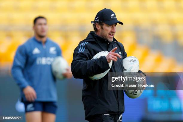 Strength and Conditioning Coach Nic Gill talks to players during a New Zealand All Blacks training session at Sky Stadium on July 14, 2022 in...